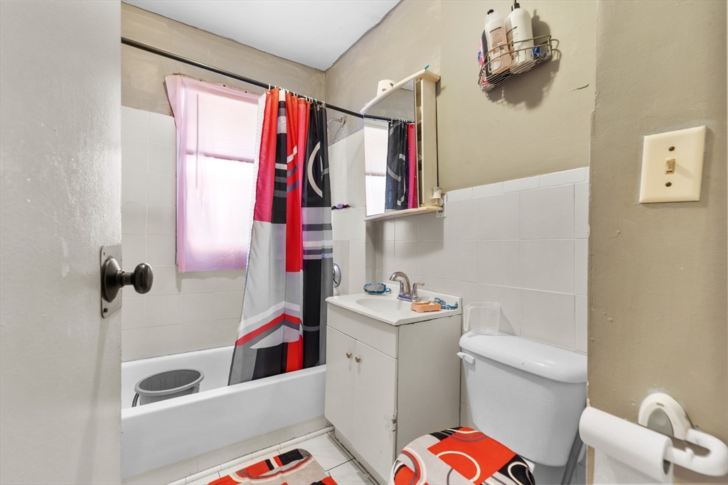 46 Theodore Street Boston, MA 02124 - Photo 12 of 24 a bathroom with a sink toilet and shower