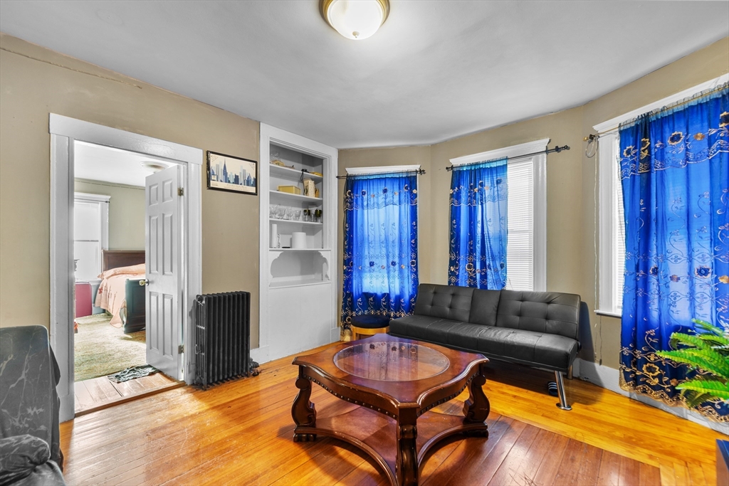 46 Theodore Street Boston, MA 02124 - Photo 8 of 24 a living room with furniture and wooden floor