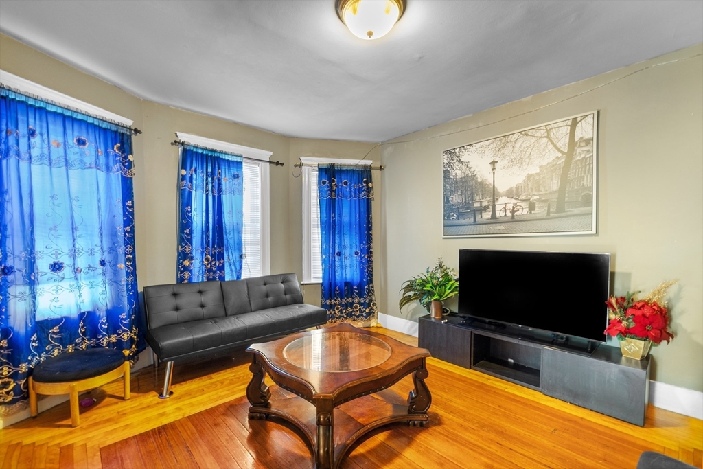 46 Theodore Street Boston, MA 02124 - Photo 9 of 24 a living room with furniture and a flat screen tv