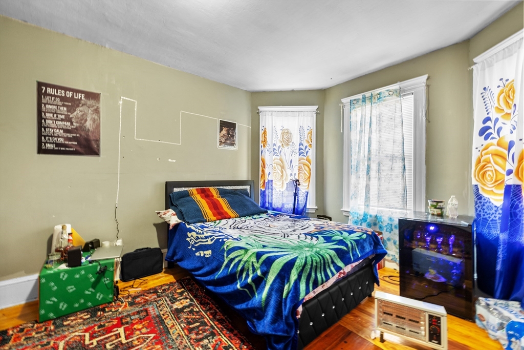 46 Theodore Street Boston, MA 02124 - Photo 10 of 24 a bedroom with bed and windows