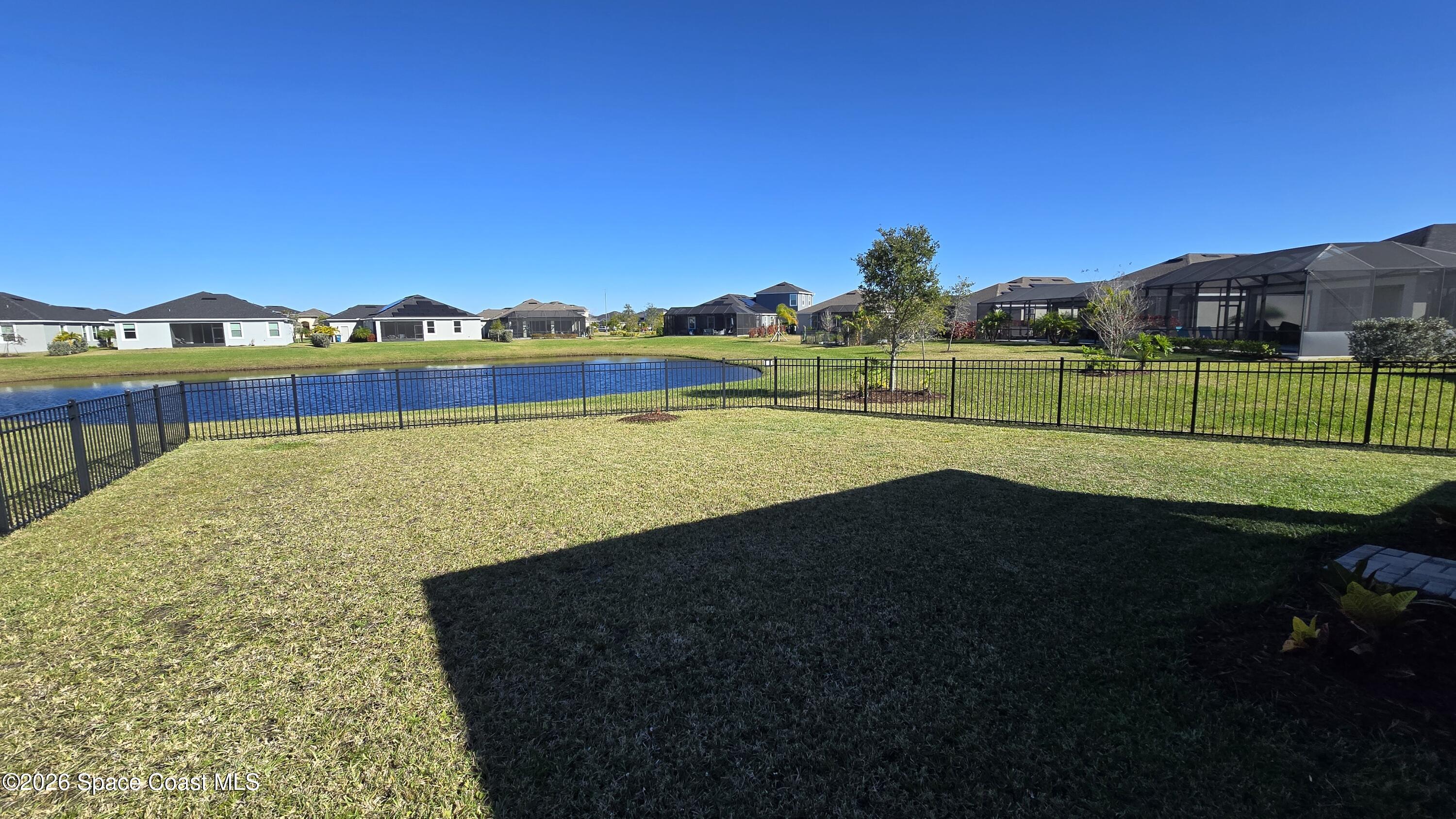 8137 Dobre Way Melbourne, FL 32940 - Photo 20 of 25 a view of a lake with a big yard