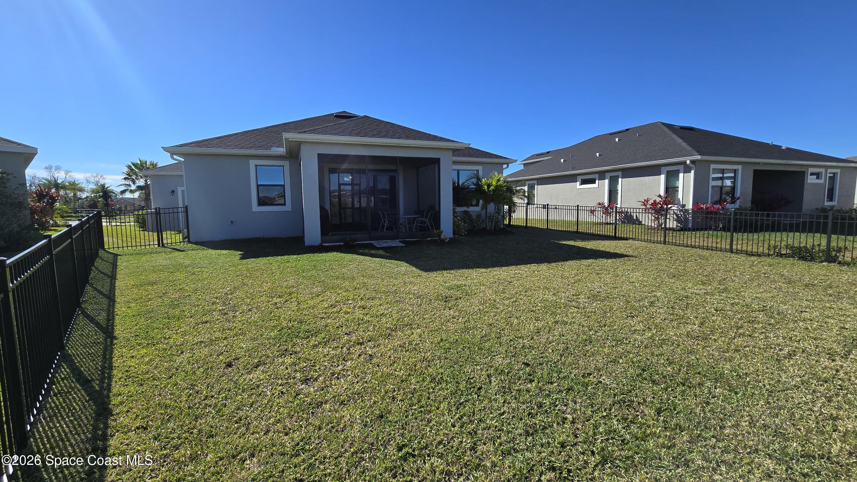 8137 Dobre Way Melbourne, FL 32940 - Photo 21 of 25 a view of a yard in front of house