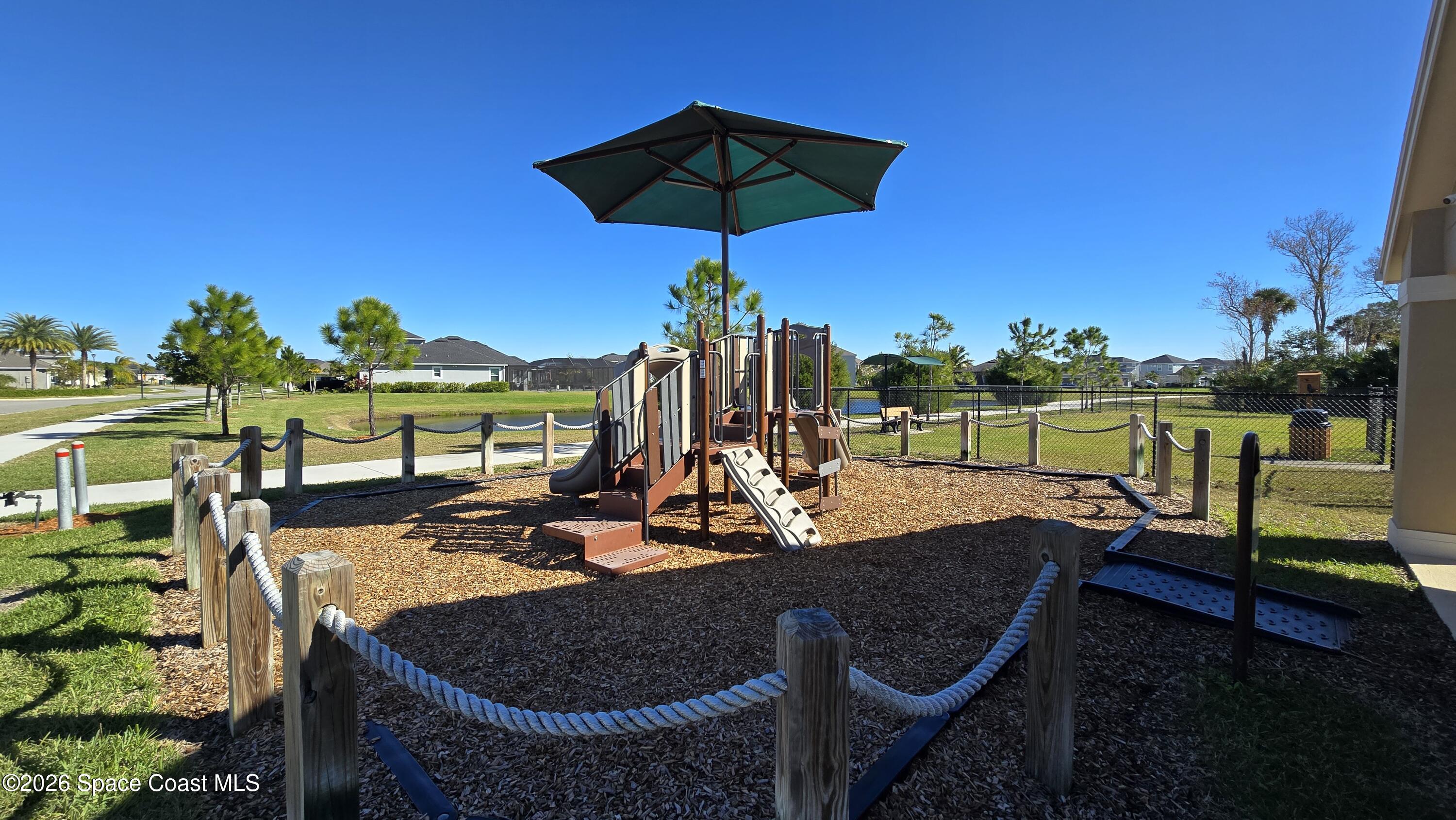 8137 Dobre Way Melbourne, FL 32940 - Photo 22 of 25 a view of a patio with swimming pool