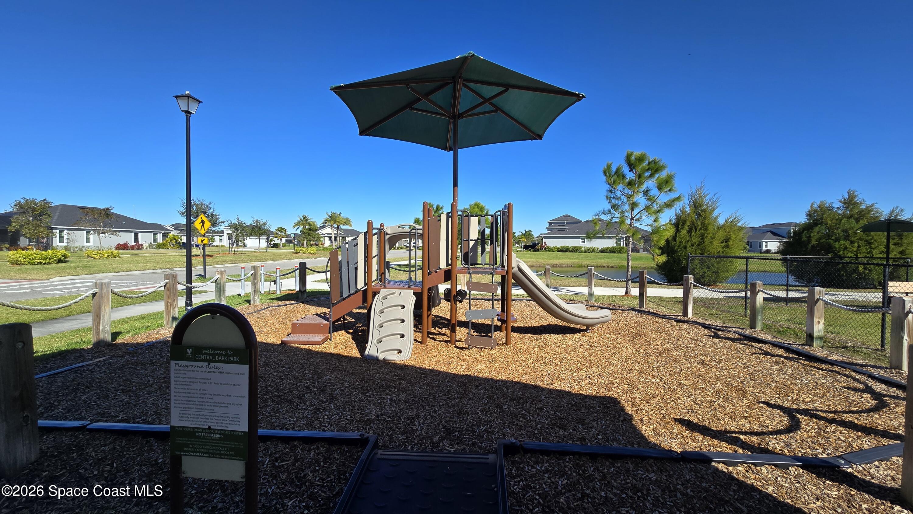 8137 Dobre Way Melbourne, FL 32940 - Photo 24 of 25 a view of a swimming pool with a lounge chairs