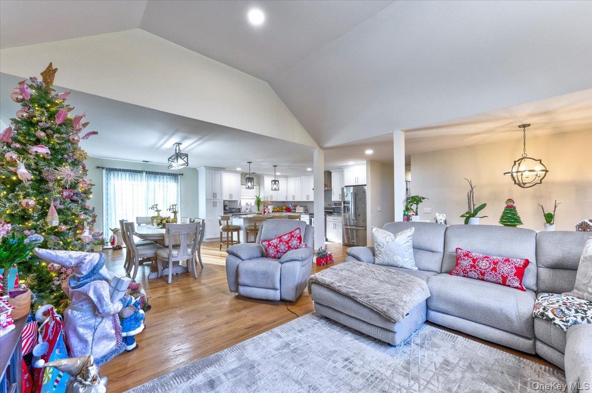 468 Granny Road Medford, NY 11763 - Photo 11 of 42 a living room with furniture and a chandelier