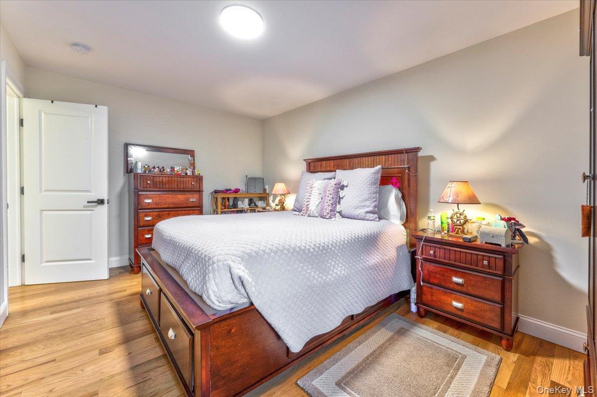 468 Granny Road Medford, NY 11763 - Photo 17 of 42 a bedroom with a bed and a dresser