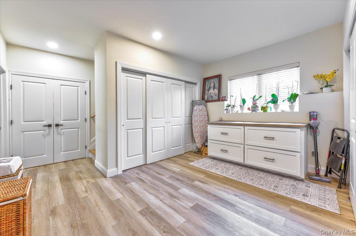 468 Granny Road Medford, NY 11763 - Photo 20 of 42 a room with a dresser and a mirror