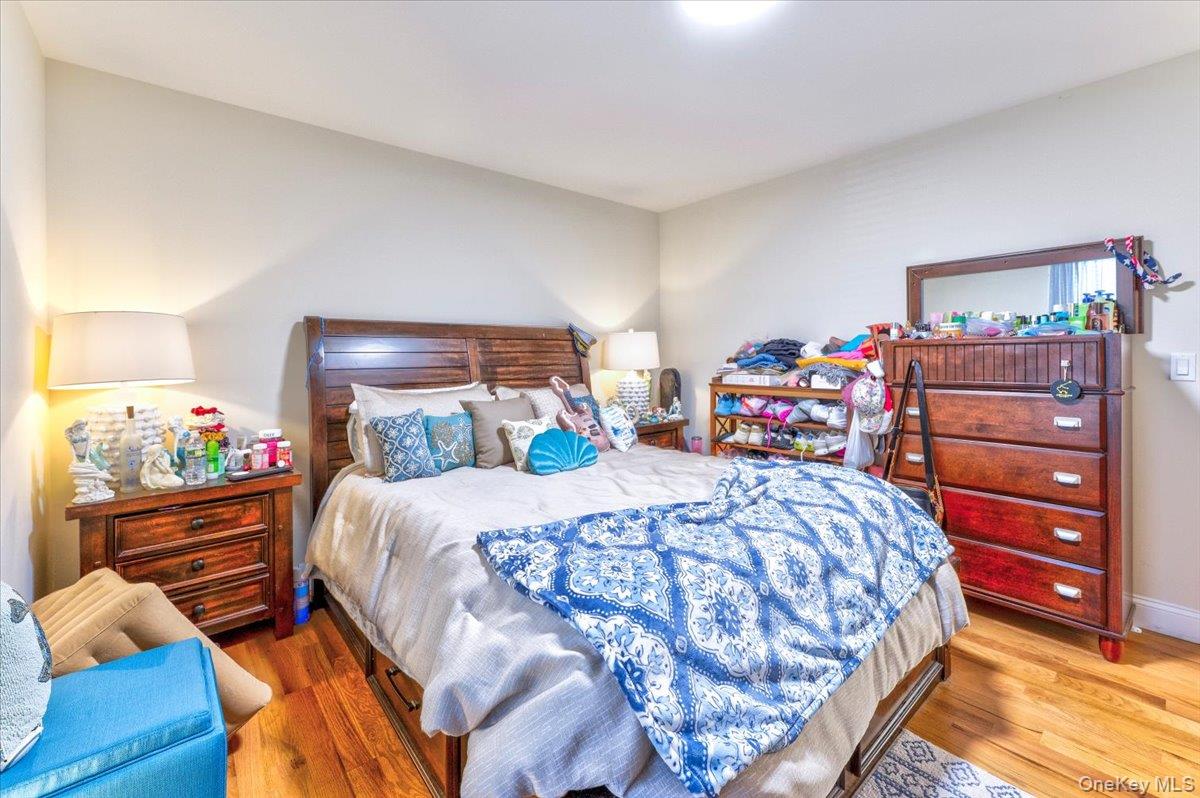 468 Granny Road Medford, NY 11763 - Photo 23 of 42 a bedroom with a bed and a dresser in it