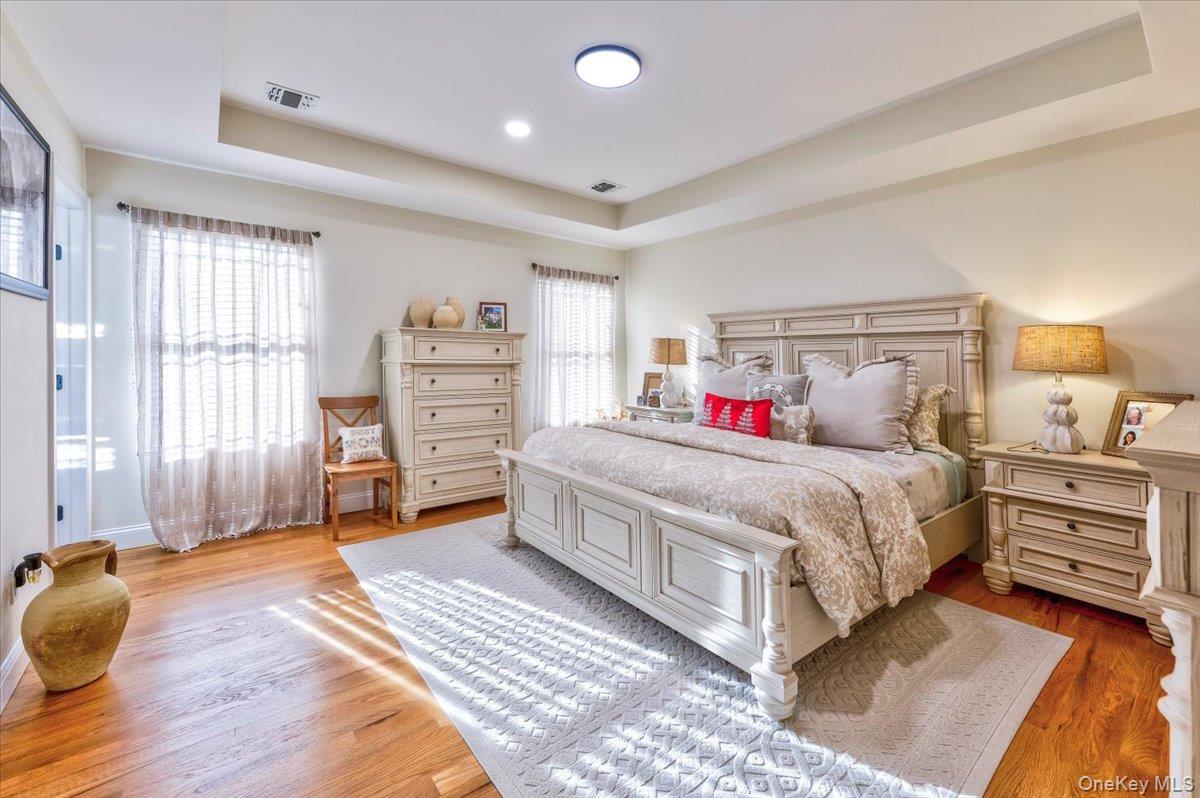 468 Granny Road Medford, NY 11763 - Photo 25 of 42 a spacious bedroom with a bed and a dresser