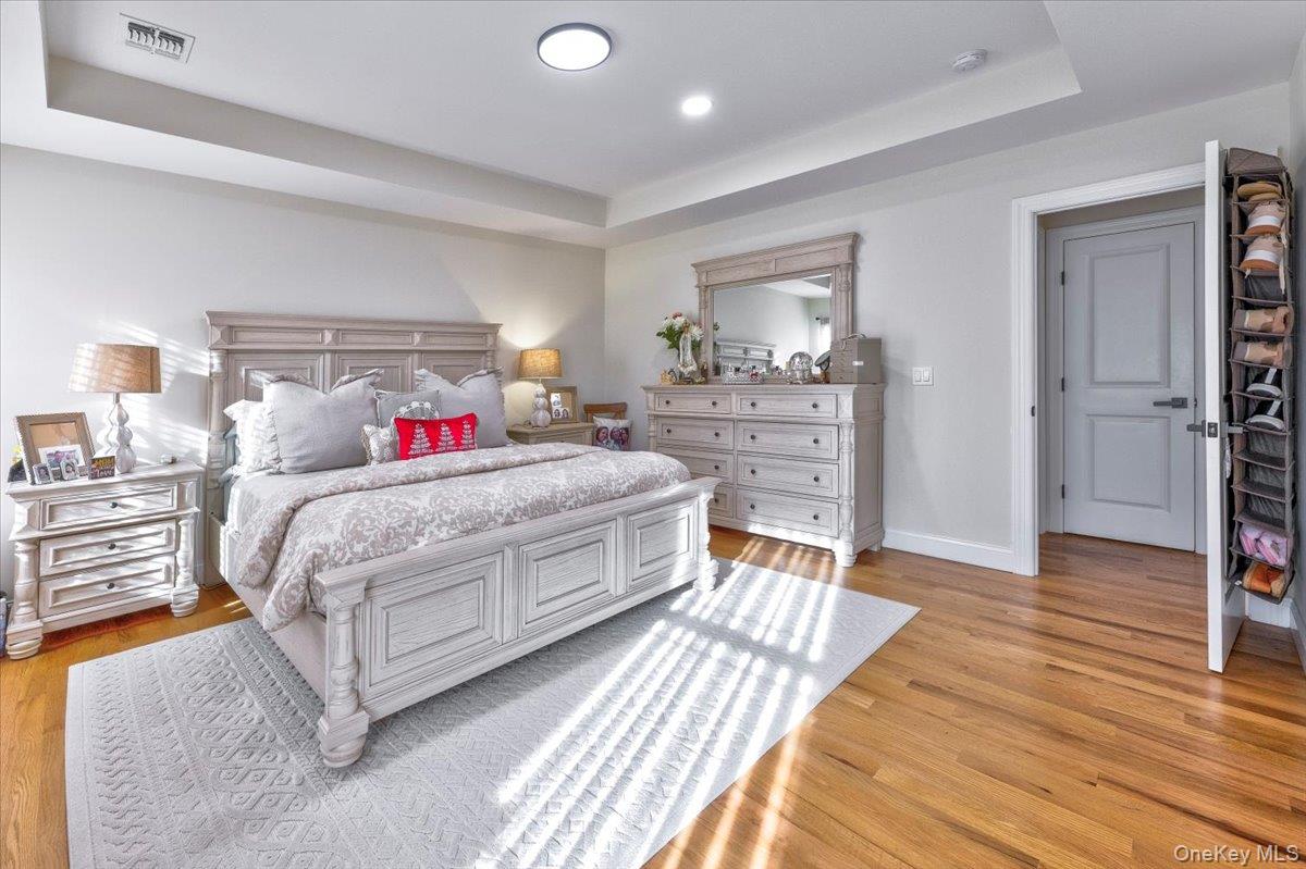 468 Granny Road Medford, NY 11763 - Photo 26 of 42 a bedroom with a bed and wooden floor