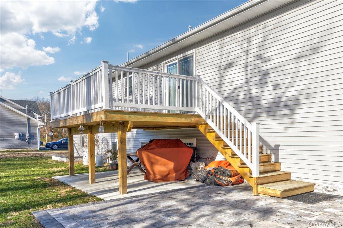 468 Granny Road Medford, NY 11763 - Photo 36 of 42 a view of a swimming pool with a bench in patio
