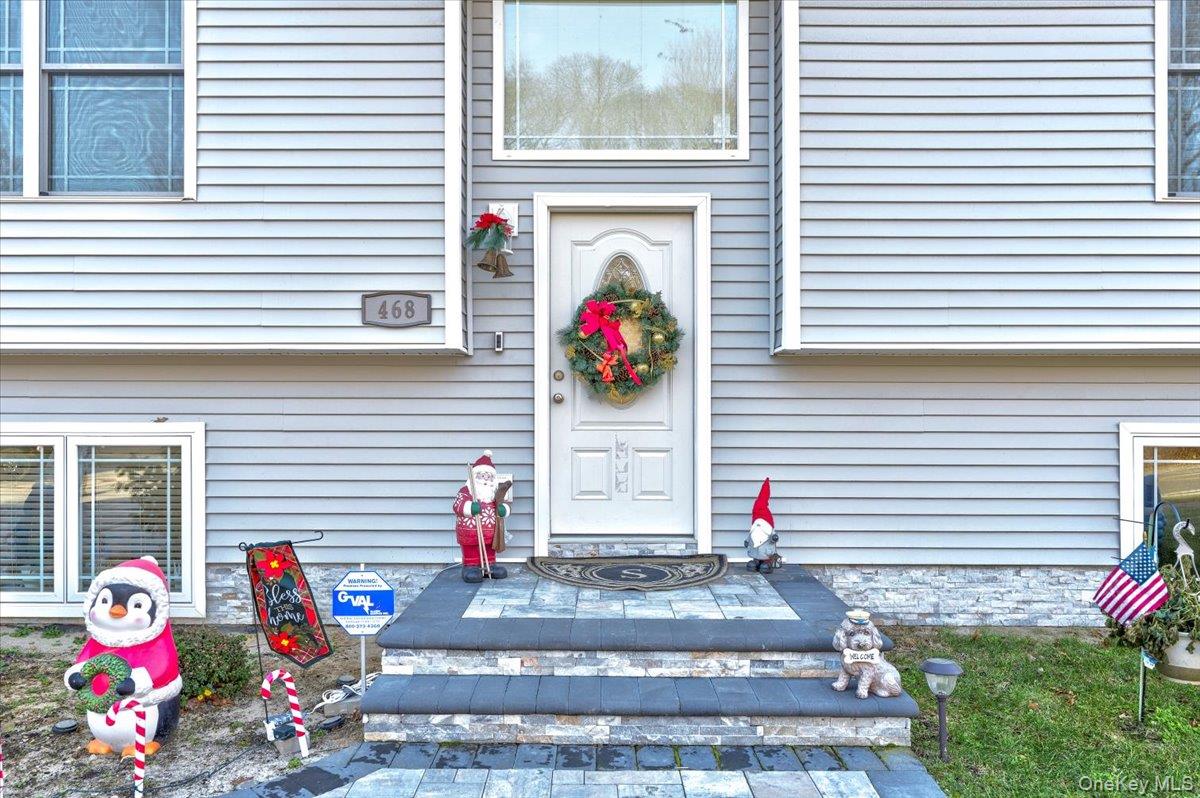 468 Granny Road Medford, NY 11763 - Photo 4 of 42 a view of front door of house with outdoor seating