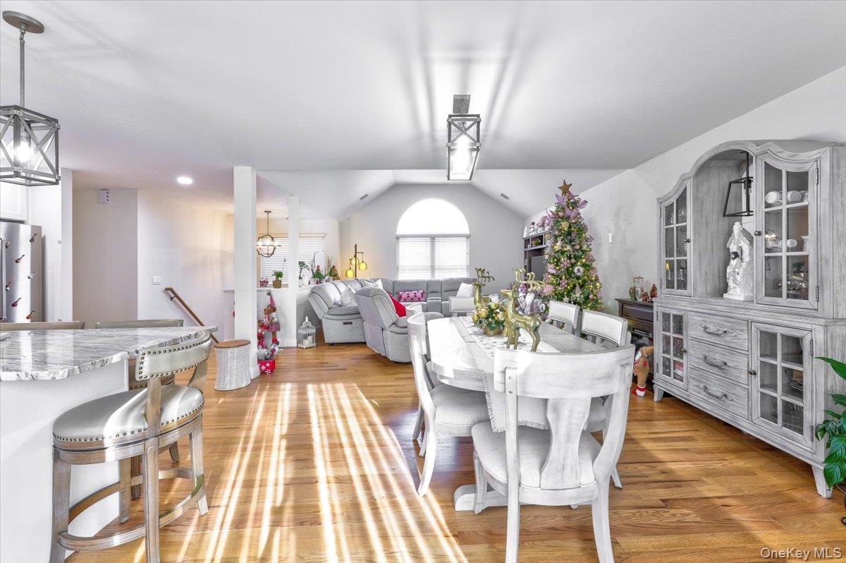 468 Granny Road Medford, NY 11763 - Photo 9 of 42 a view of a dining room with furniture and wooden floor