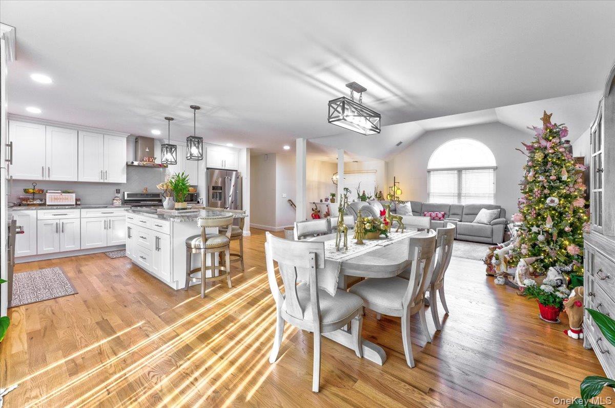 468 Granny Road Medford, NY 11763 - Photo 10 of 42 a view of a dining room with furniture window and wooden floor