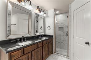 238 Rudder Road Gun Barrel City, TX 75156 - Photo 18 of 27 a bathroom with a granite countertop sink and a mirror