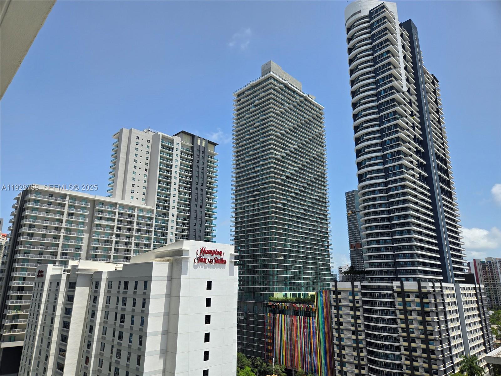 79 Southwest 12th Street, Unit 1701S Miami, FL 33130 - Photo 16 of 25 a view of a building with a yard
