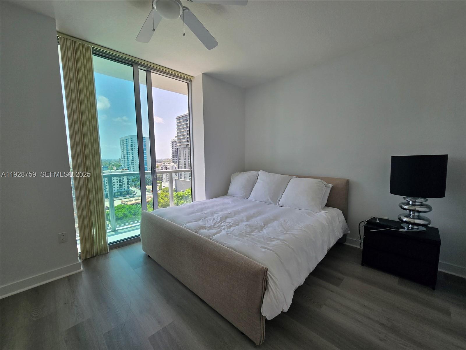 79 Southwest 12th Street, Unit 1701S Miami, FL 33130 - Photo 8 of 25 a bedroom with a bed and a window