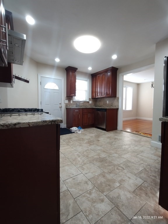 62 Washington Street, Unit 62 Wellesley, MA 02481 - Photo 3 of 18 a large bathroom with a large tub and sink