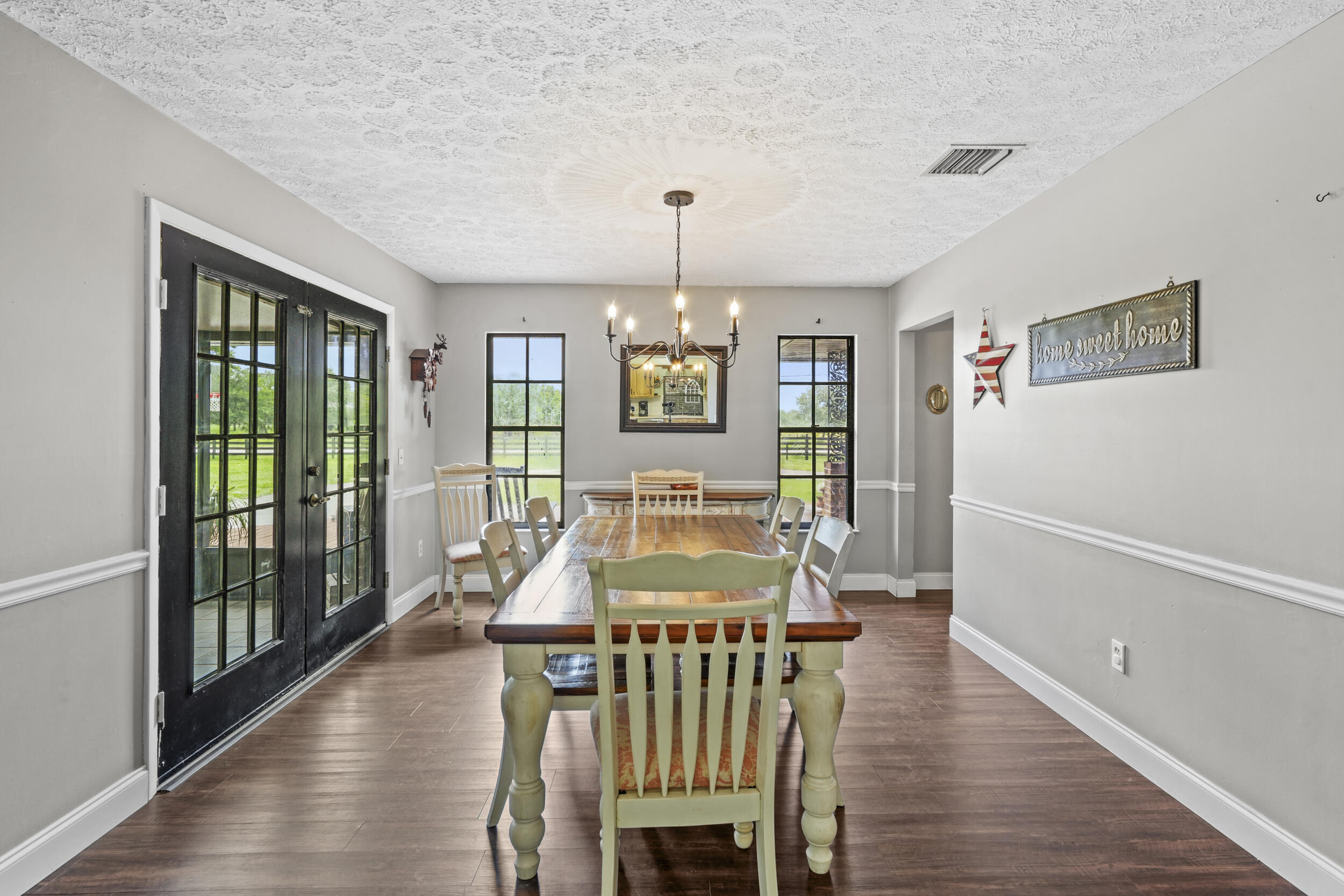 4170 McCarty Road Fort Pierce, FL 34945 - Photo 22 of 57 a view of a dining room with furniture window and wooden floor