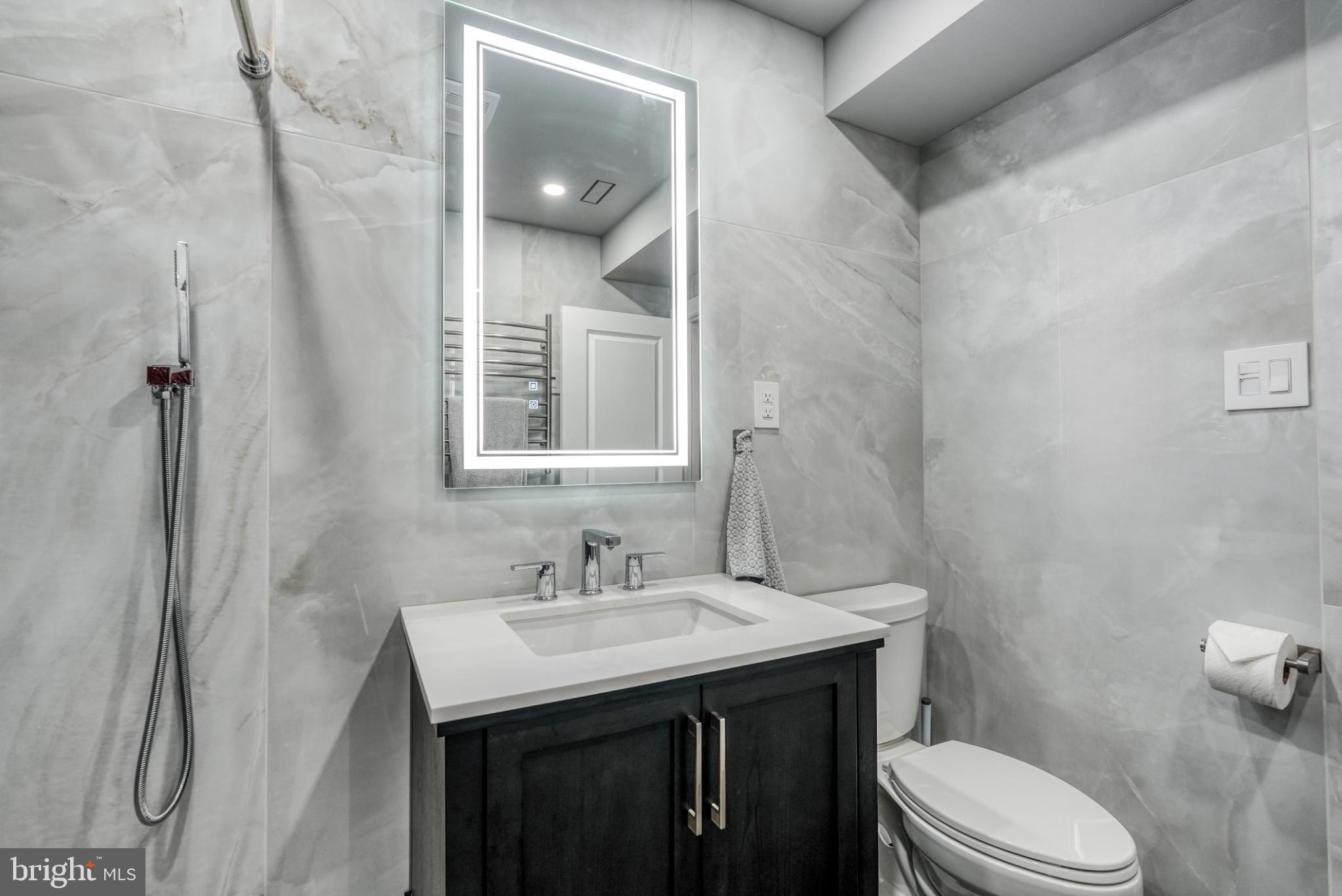 9502 Hilspach Street Philadelphia, PA 19115 - Photo 33 of 53 a bathroom with a sink vanity mirror and toilet