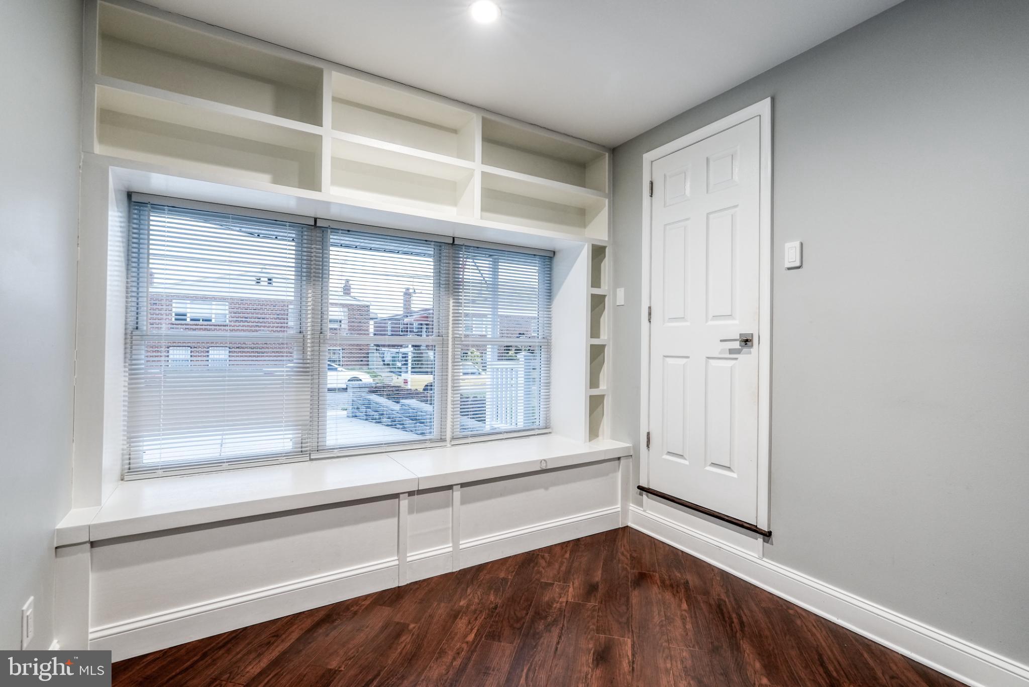 9502 Hilspach Street Philadelphia, PA 19115 - Photo 38 of 53 a view of an empty room with wooden floor and a window