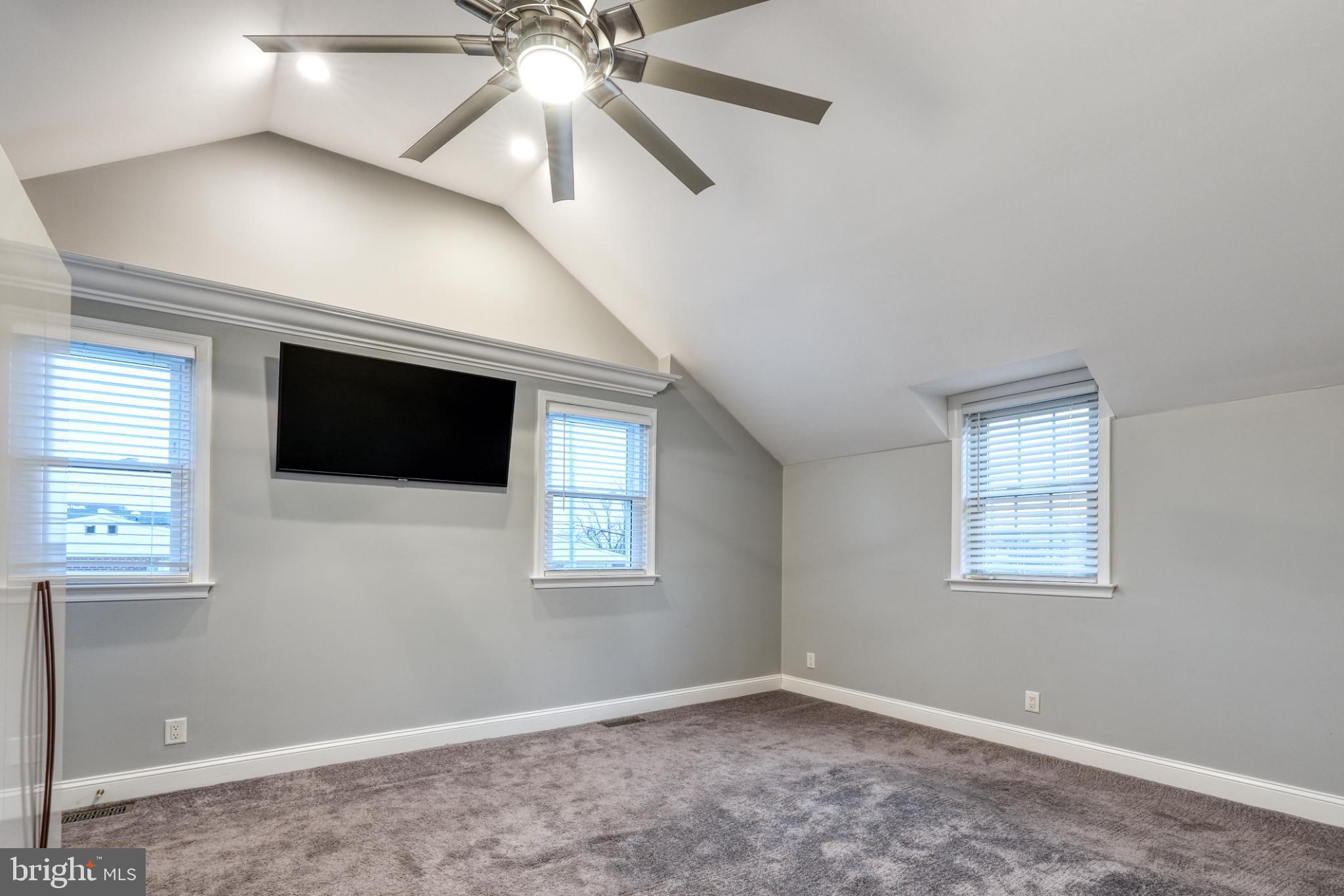 9502 Hilspach Street Philadelphia, PA 19115 - Photo 39 of 53 a view of an empty room with a window and a ceiling fan