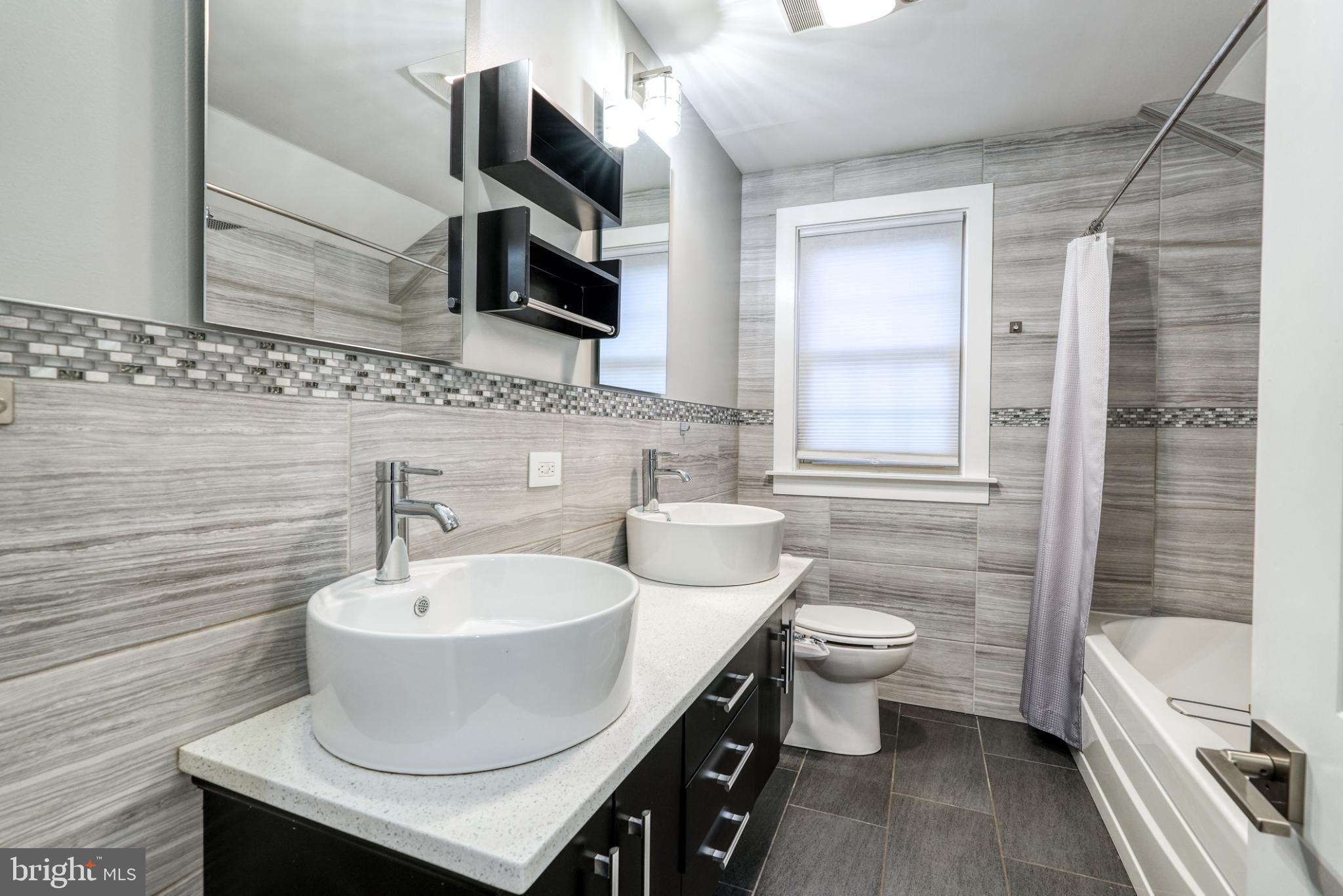 9502 Hilspach Street Philadelphia, PA 19115 - Photo 44 of 53 a bathroom with a sink a toilet and shower