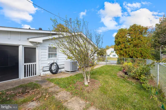 a view of a back yard of the house