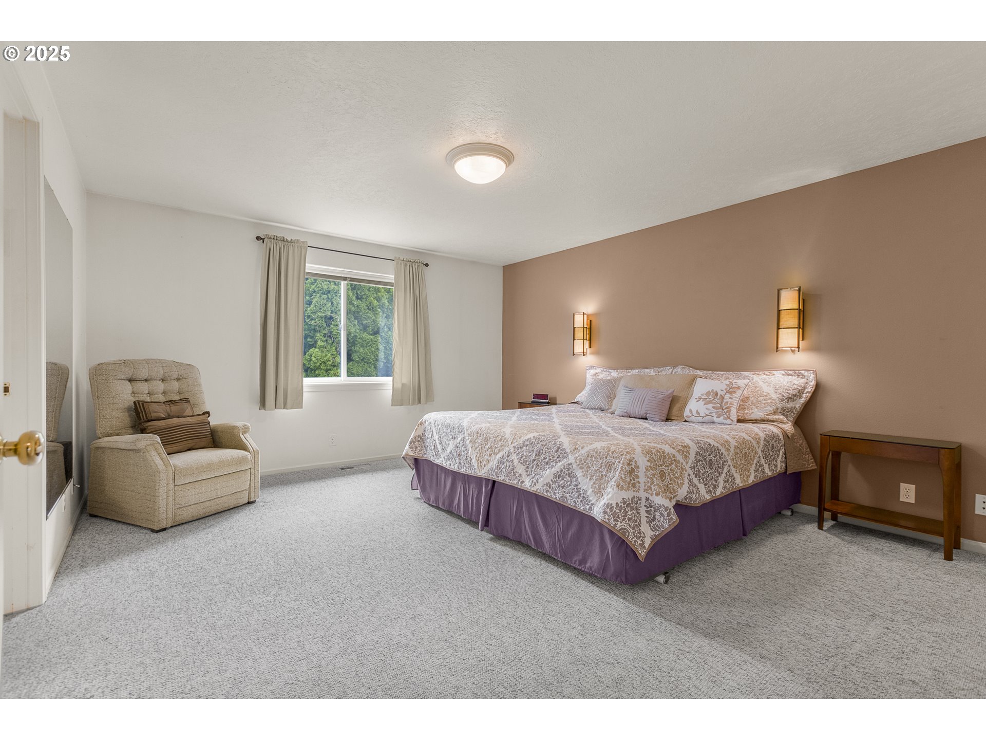 2335 Sony Loop Eugene, OR 97404 - Photo 13 of 30 a spacious bedroom with a bed and a couch