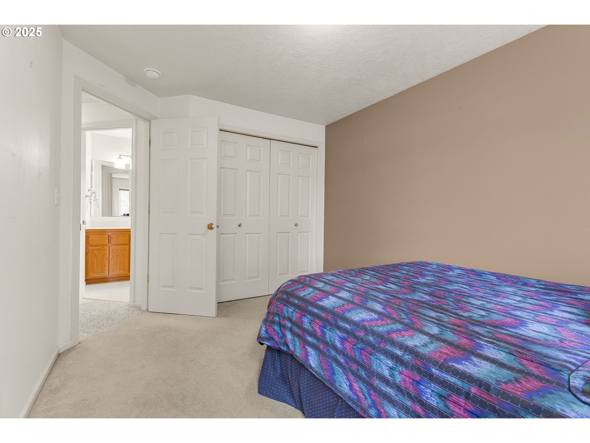 2335 Sony Loop Eugene, OR 97404 - Photo 22 of 30 a bedroom with a bed and a table