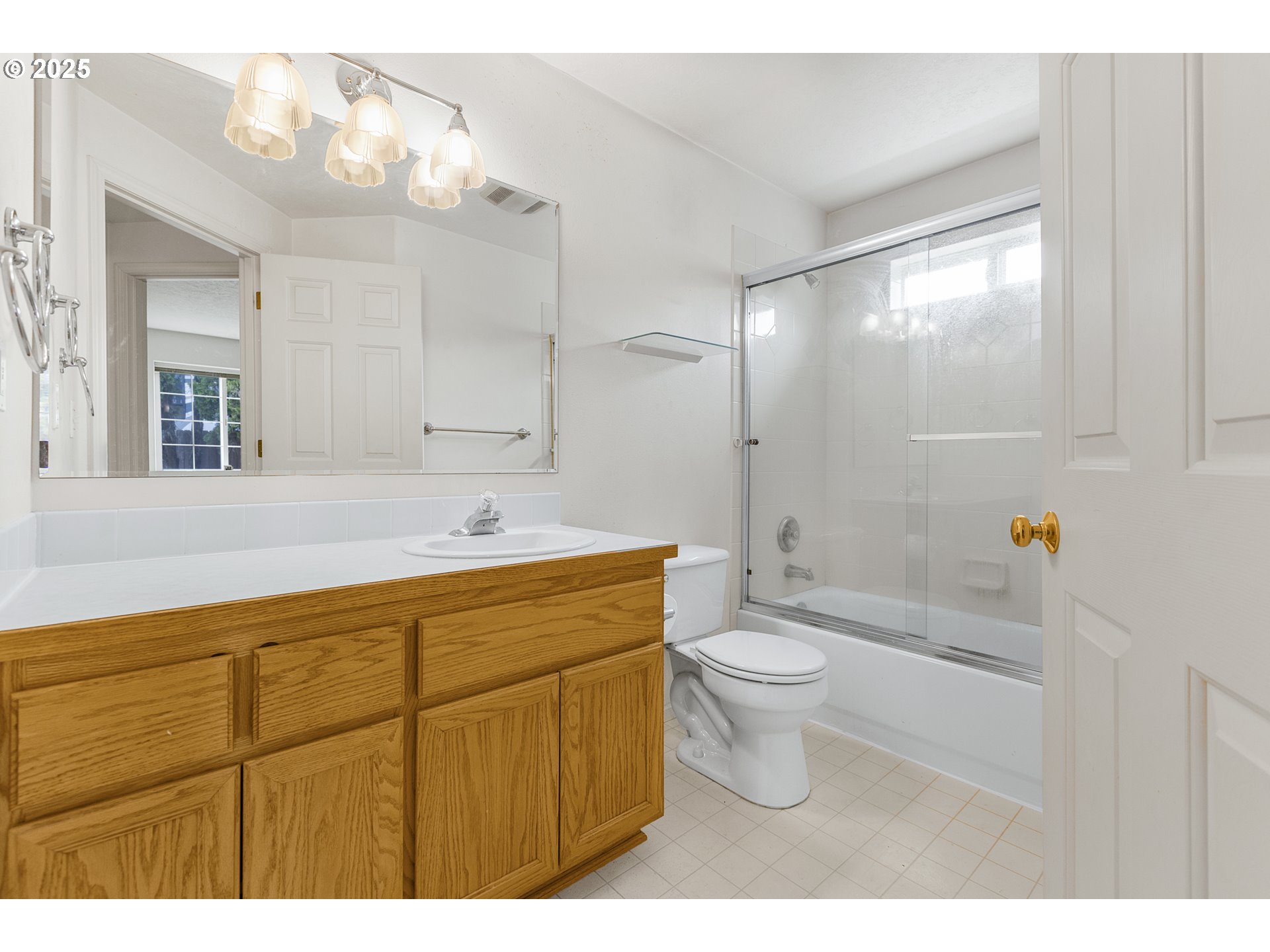 2335 Sony Loop Eugene, OR 97404 - Photo 23 of 30 a bathroom with a double vanity sink mirror and toilet
