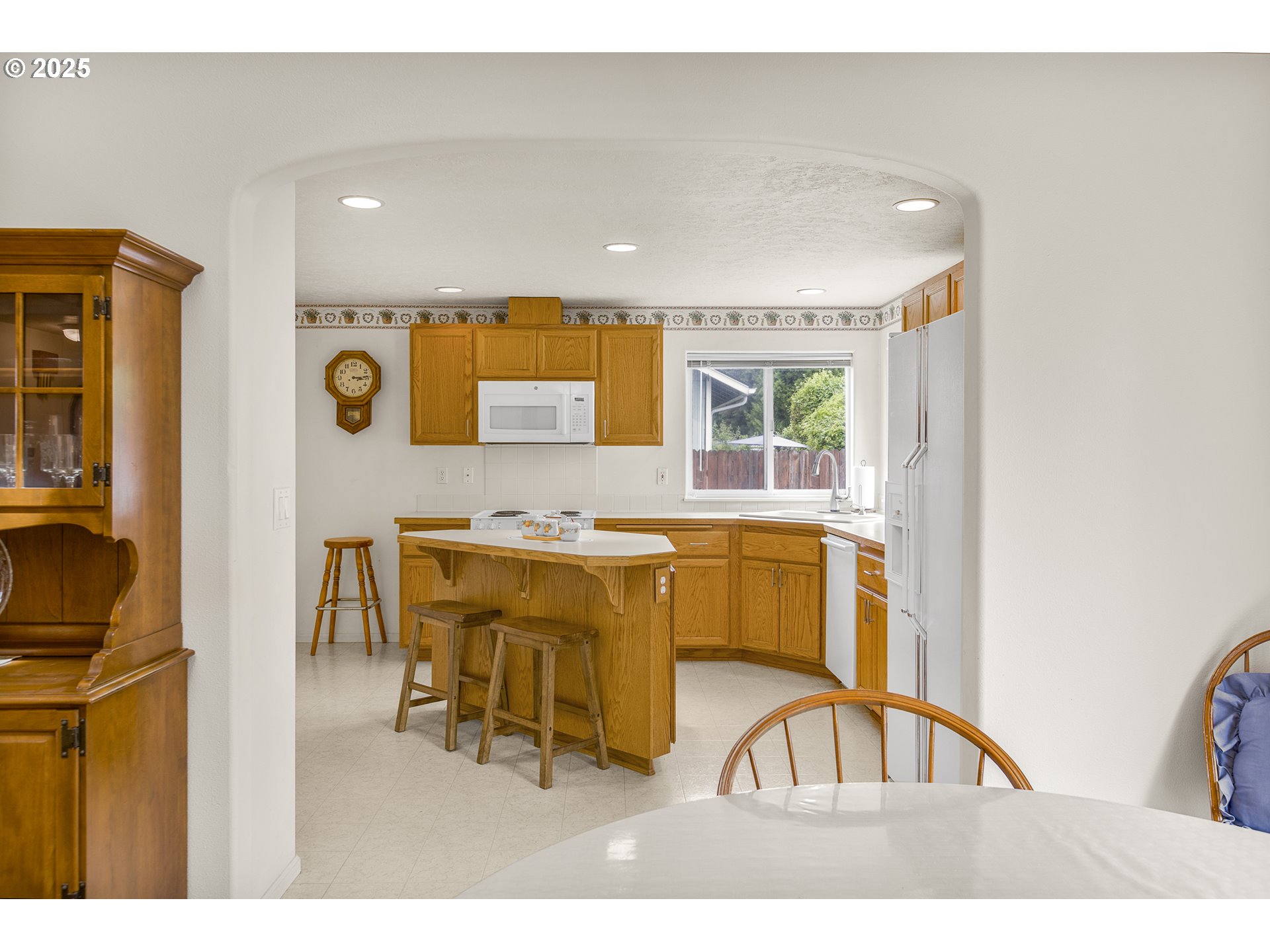 2335 Sony Loop Eugene, OR 97404 - Photo 8 of 30 a kitchen with stainless steel appliances granite countertop a sink and a microwave
