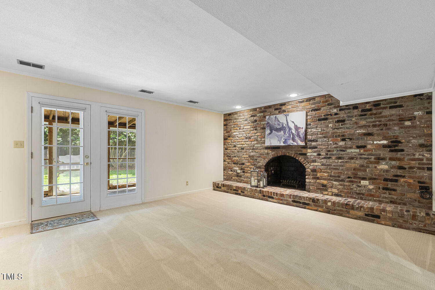 1000 Winona Road Raleigh, NC 27609 - Photo 14 of 36 Full wall, masonry fireplace in large family/rec room