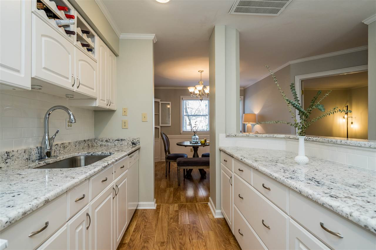 7010 Sandy Forks Road, Unit 207 Raleigh, NC 27609 - Photo 17 of 27 Kitchen opens up to dining room and is perfect for entertaining guests! Kitchen