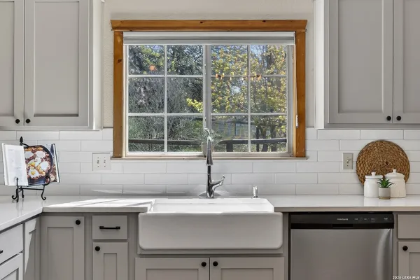 a kitchen with a sink and a window