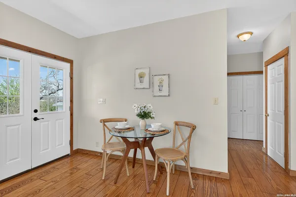 a view of a dining room with furniture and wooden floor