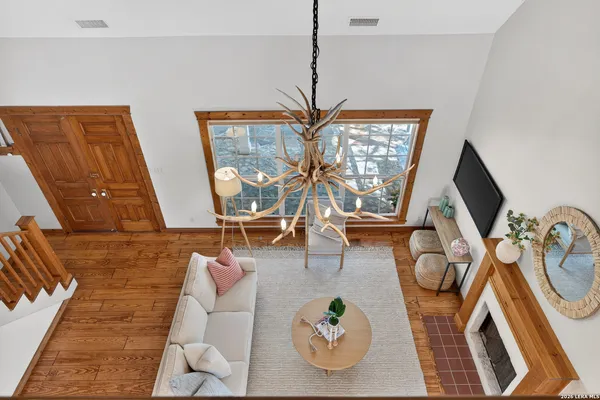a living room with furniture and flat screen tv