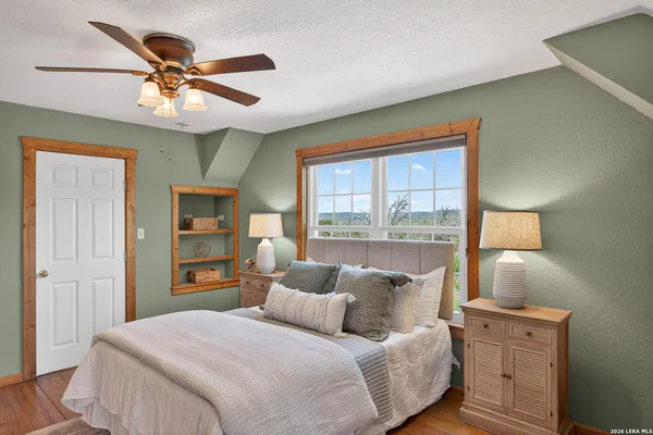 a bedroom with a bed and window