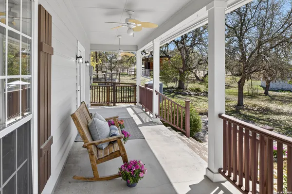 a view of balcony with wooden floor