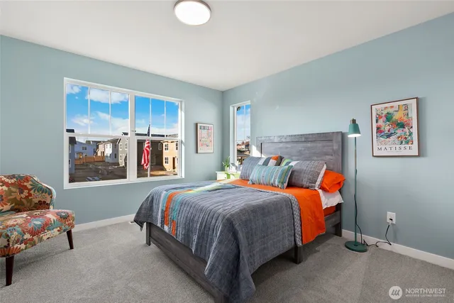 a bedroom with a bed and wall painting