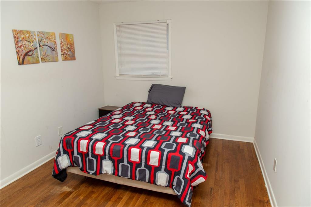 1681 Atherton Circle Decatur, GA 30035 - Photo 8 of 17 a bed sitting in a bedroom next to a window