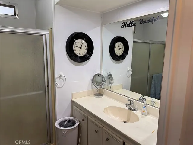 a bedroom with two beds and a window