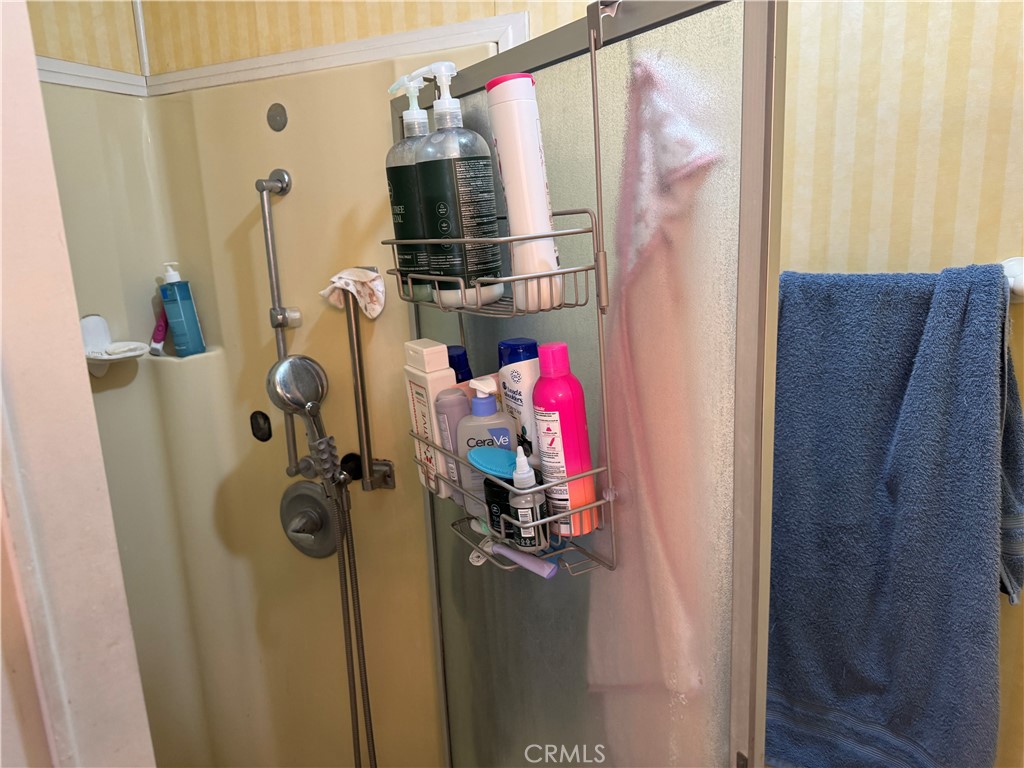 929 East Foothill Boulevard, Unit 91 Upland, CA 91786 - Photo 27 of 32 a view of walk in closet with clothes and shoes