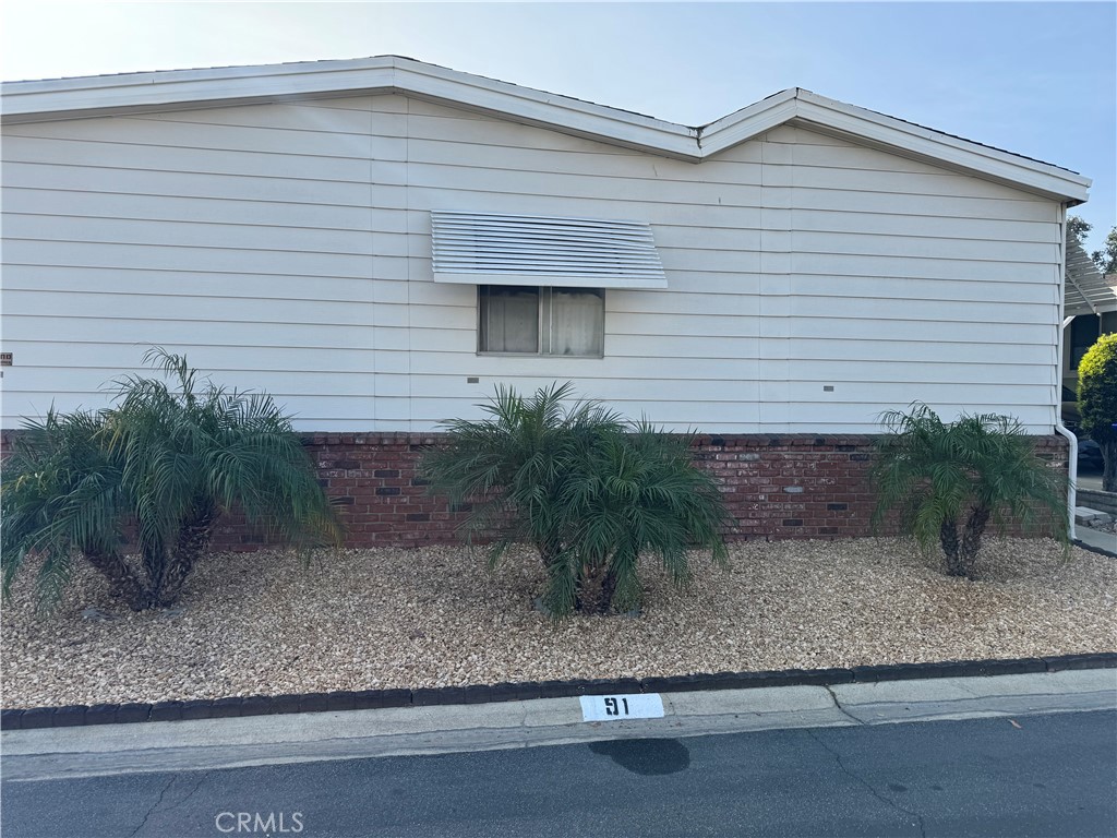 929 East Foothill Boulevard, Unit 91 Upland, CA 91786 - Photo 5 of 32 a view of a house with a yard and plants