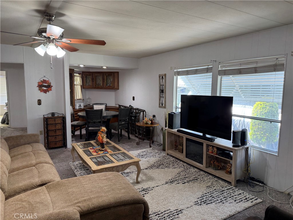 929 East Foothill Boulevard, Unit 91 Upland, CA 91786 - Photo 9 of 32 a living room with furniture and a flat screen tv
