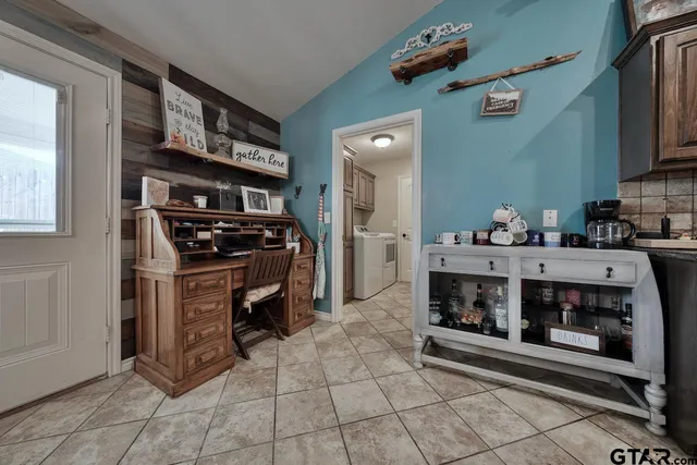 a kitchen with a stove and cabinets