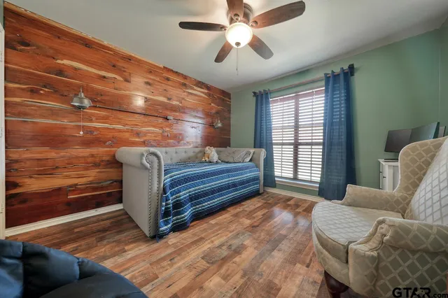 a bedroom with furniture and a window