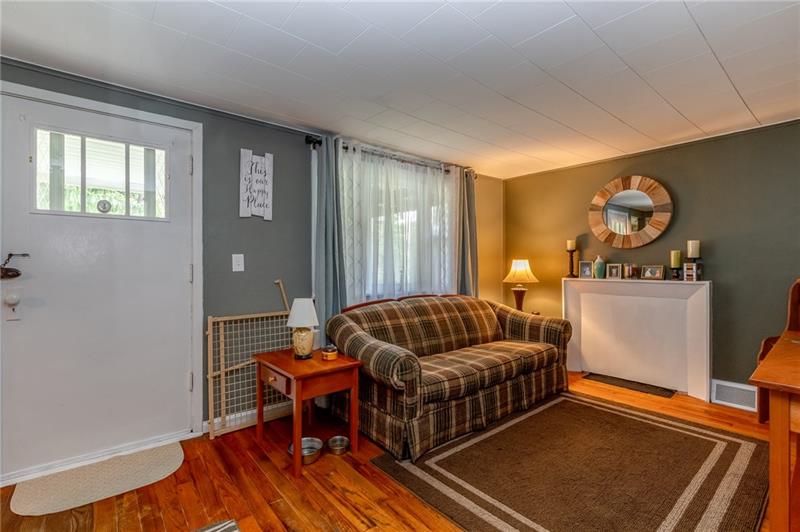 1869 B Barclay Hill Road Beaver, PA 15009 - Photo 6 of 23 Living room with original hardwood floors, great paint colors and a large picture window.