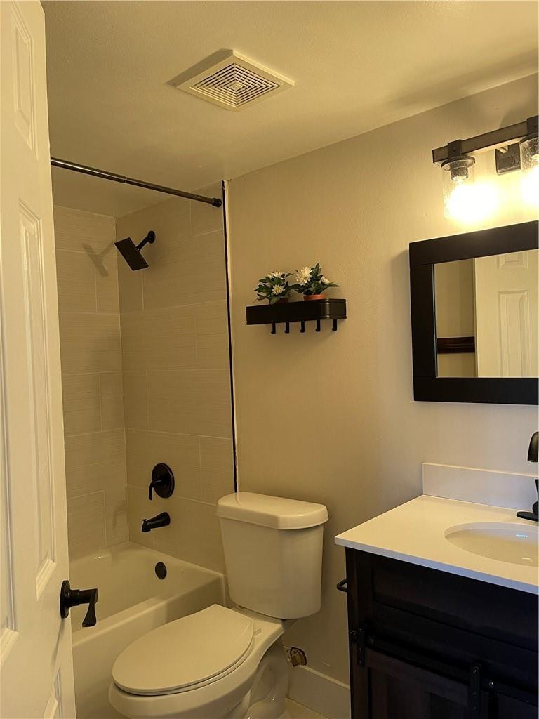 8801 Wiles Road, Unit 108 Coral Springs, FL 33067 - Photo 12 of 22 a bathroom with a sink a toilet and shower