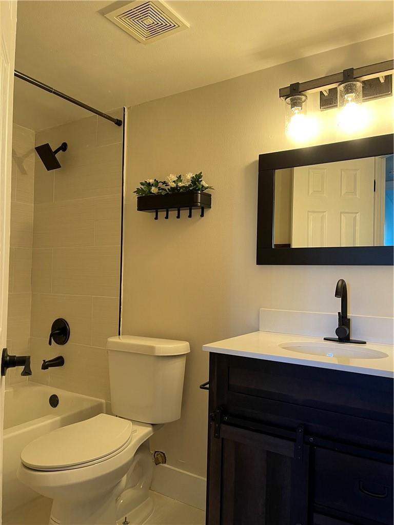 8801 Wiles Road, Unit 108 Coral Springs, FL 33067 - Photo 13 of 22 a bathroom with a sink a toilet and shower